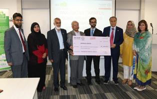 Mr Said Gul, Managing Director, Pak Qatar Takaful Group presenting full scholarship cheque to Mr. Ammar Awais, outstanding student of MS Islamic Banking and Finance